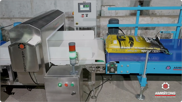 Bag Turning & Tilting Conveyor With Weighing & Metal Detector System